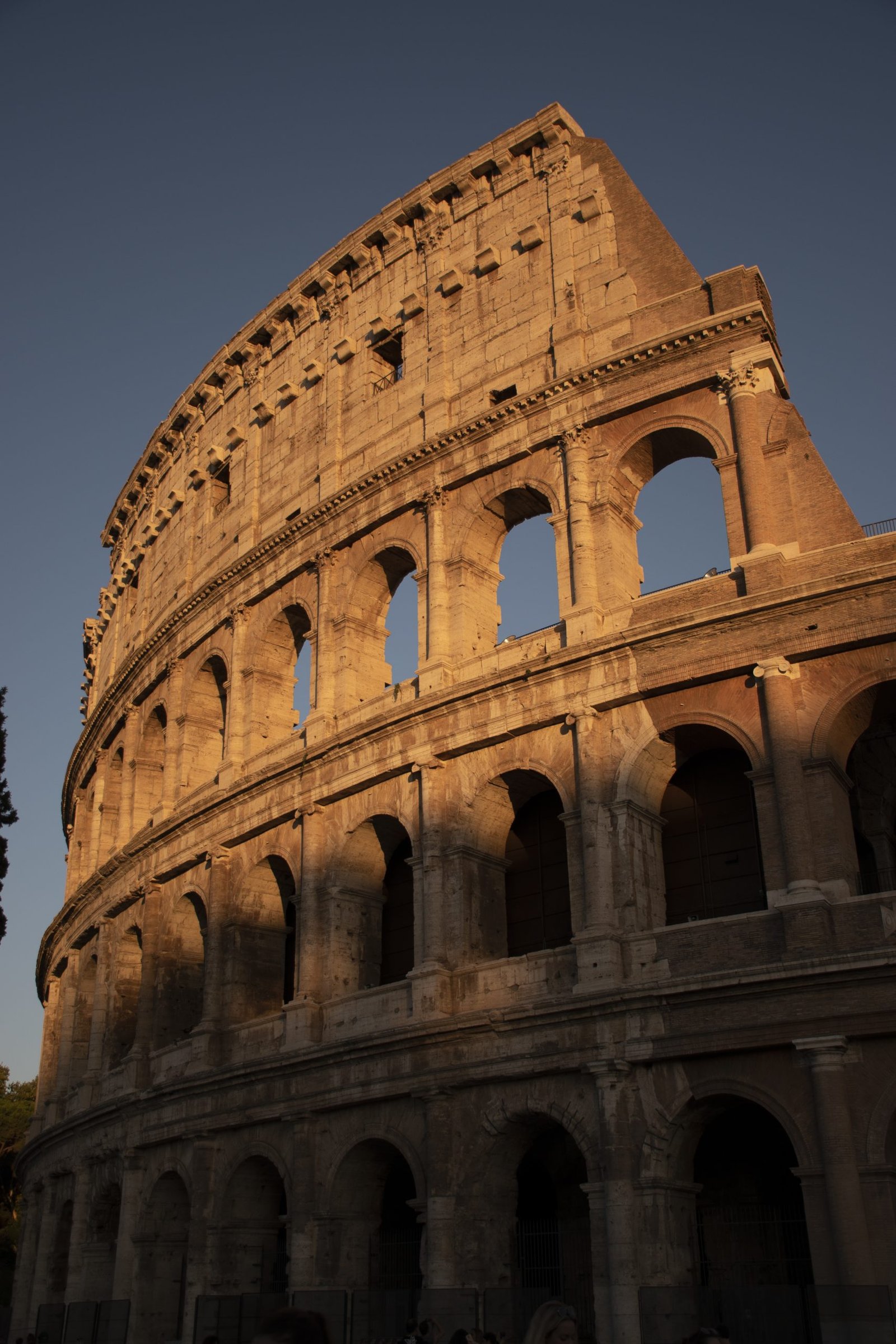 vertical-shot-famous-colosseum-rome-italy-sunset-scaled